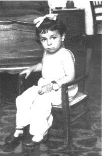 Photo of Nadina - 4years old - sitting and looking very serious
